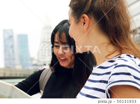 Young women smile portrait and traveling in city. Young women smile portrait and traveling in city. 50131933