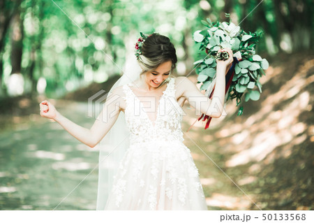 Beautiful fashion bride in wedding dress posing Beautiful fashion bride in wedding dress posing 50133568