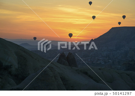 Flight of balloons at sunrise in Cappadocia Flight of balloons at sunrise in Cappadocia 50141297