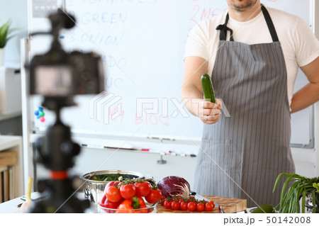 Male Vlogger Recording Healthy Vegetable Recipe Male Vlogger Recording Healthy Vegetable Recipe 50142008