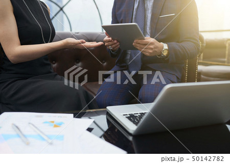 Business people using digital tablet at office 50142782