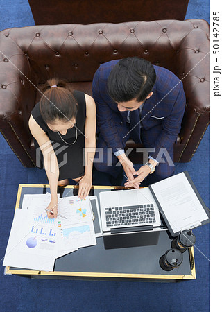 Business people analyzing business charts 50142785