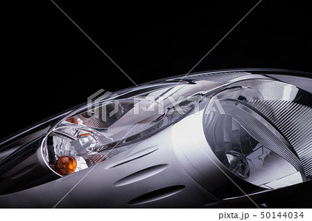 a car headlight on a black background a car headlight on a black background 50144034