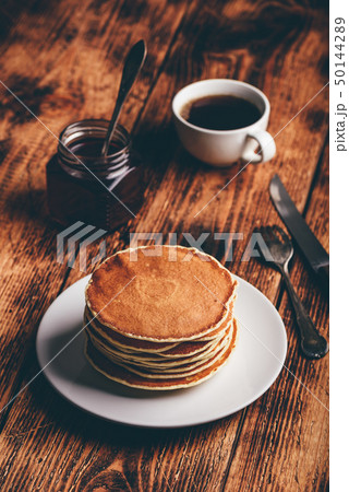 Stack of pancakes on white plate Stack of pancakes on white plate 50144289