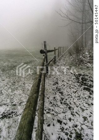 Winter footpath around wooden corral Winter footpath around wooden corral 50145447