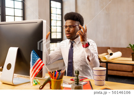 Handsome young man having a problem at work 50146106