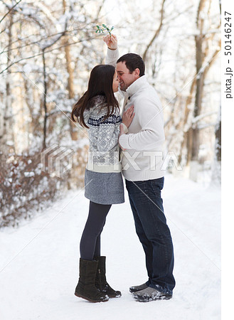 Happy young couple having fun in the winter park Happy young couple having fun in the winter park 50146247