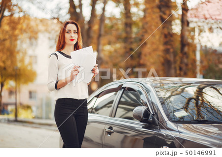 The girl walks on the streets of the city The girl walks on the streets of the city 50146991