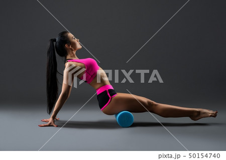 Beautiful fitness model in pink sportswear shot 50154740