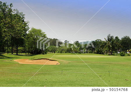 The evening golf course has sunlight in Thailand The evening golf course has sunlight in Thailand 50154768