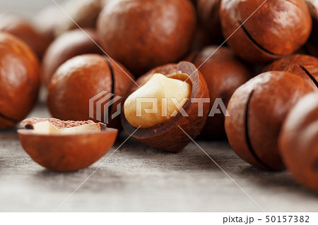 Macadamia nut on a wooden table in a bag, closeup, Macadamia nut on a wooden table in a bag, closeup, 50157382