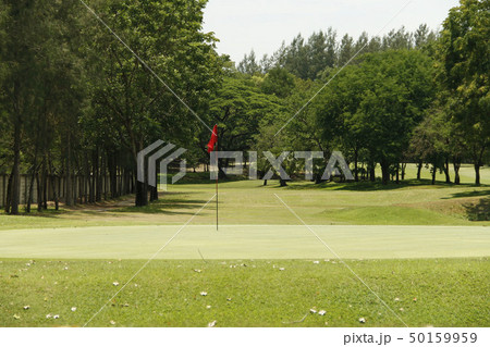 The evening golf course has sunlight in Thailand 50159959