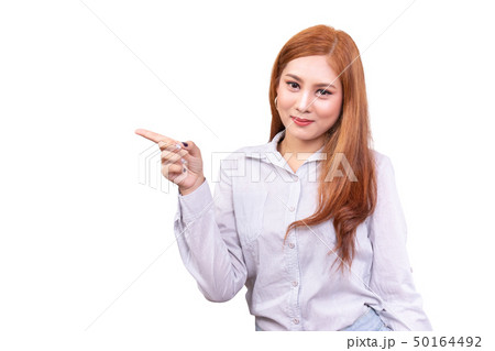 smiling Asian woman pointing to empty copy space 50164492