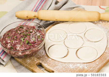 fresh raw dough and beef forcemeat 50165503