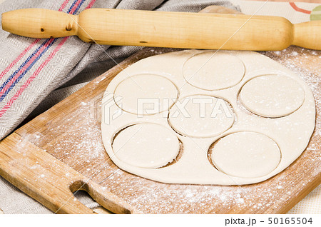 fresh raw dough and rolling pin fresh raw dough and rolling pin 50165504