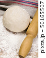 fresh raw dough and rolling pin 50165507
