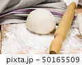 fresh raw dough and rolling pin 50165509