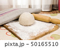 fresh raw dough and rolling pin 50165510
