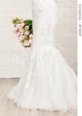 Wedding bouquet of tulips in bride's hands Wedding bouquet of tulips in bride's hands 50169153