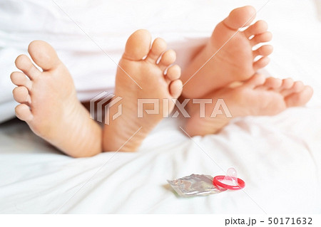 legs feet of two Lovers sleeping side by side 50171632