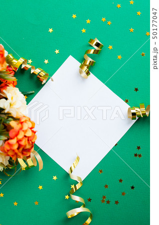White paper sheet, golden decorations and sparkles 50177047