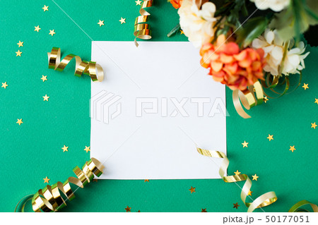 White paper sheet, golden decorations and sparkles 50177051