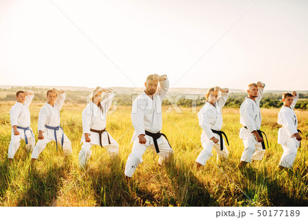 Karate class work out the stand, training in field Karate class work out the stand, training in field 50177189