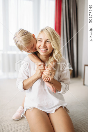 Mother and child playing at home 50177549