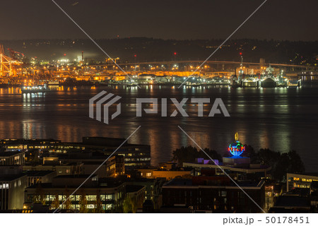 Orange lights iluminate the port of Seattle and Elliott Bay at night. Orange lights iluminate the port of Seattle and Elliott Bay at night. 50178451