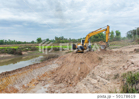 Yellow excavator machine working earth moving Yellow excavator machine working earth moving 50178619