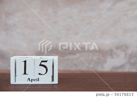 Tax day with 15th April. Calendar wooden block Tax day with 15th April. Calendar wooden block 50178813