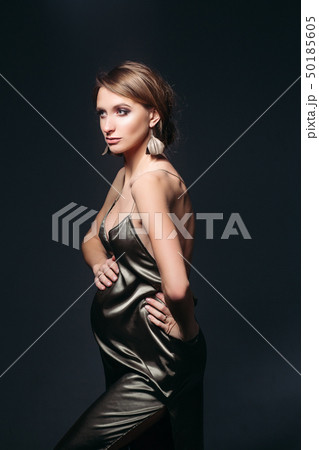 Sensual pregnant woman in sexy silk dress Sensual pregnant woman in sexy silk dress 50185605