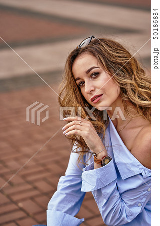 Portrait of a young beautiful woman with brown 50186834