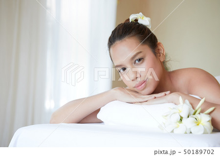 Close up of attractive young Asian woman get spa Close up of attractive young Asian woman get spa 50189702