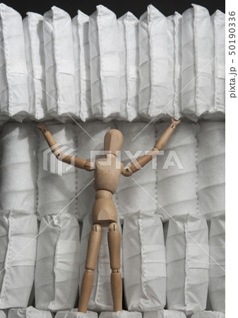 wooden puppet on supports spring blocks 50190336