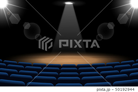 chairs and stage with spotlight in the hall	 50192944