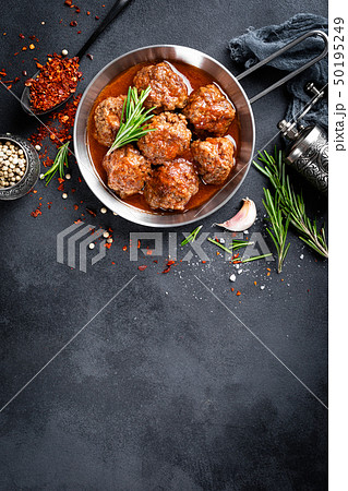 Beef meatballs with spices in tomato sauce 50195249