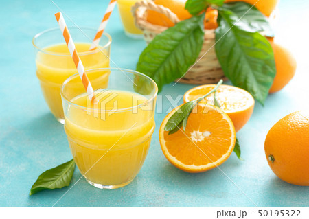 Orange freshly squeezed juice in glass and fresh Orange freshly squeezed juice in glass and fresh 50195322