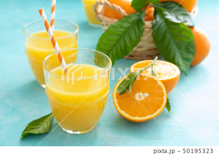 Orange freshly squeezed juice in glass and fresh Orange freshly squeezed juice in glass and fresh 50195323