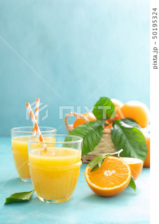 Orange freshly squeezed juice in glass and fresh Orange freshly squeezed juice in glass and fresh 50195324