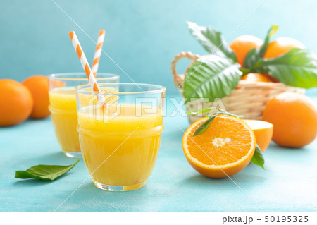 Orange freshly squeezed juice in glass and fresh Orange freshly squeezed juice in glass and fresh 50195325