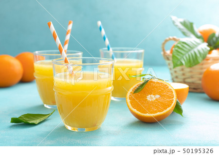 Orange freshly squeezed juice in glass and fresh Orange freshly squeezed juice in glass and fresh 50195326