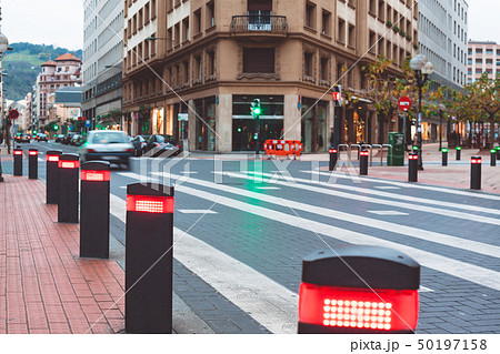 Modern traffic lights posts on pedestrian crossing 50197158