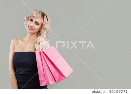 Cheerful woman with shopping bags, portrait. 50197271