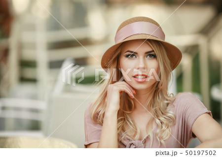 Winking sensual model Girl touching her face,manicure nails,beauty teen face isolated on white 50197502