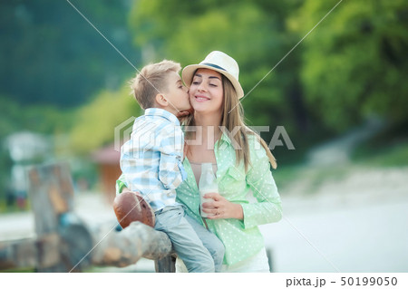 Mother and son holding hand in hand 50199050