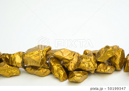 A pile of gold nuggets or gold ore isolated on 50199347