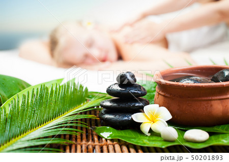 Spa massage outdoor. Beautiful young woman getting 50201893