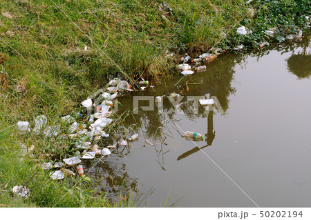 Plastic garbage in the river , pollution and Plastic garbage in the river , pollution and 50202194