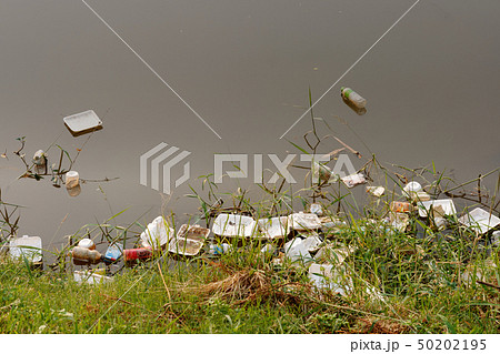 Plastic garbage in the river , pollution and Plastic garbage in the river , pollution and 50202195